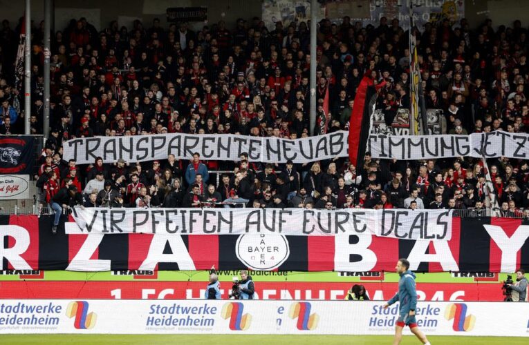 Fans protest against Bundesliga’s controversial plan of media rights sale with tennis balls during Leverkusen match