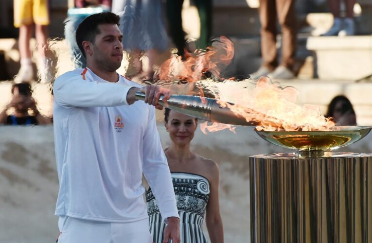 Greece hands Olympic flame to 2024 Paris Games host