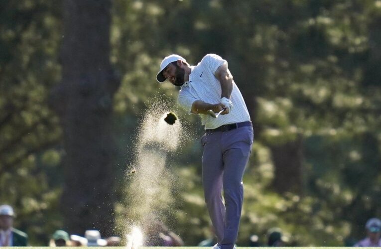 Scheffler leads midway through Masters third round, Woods struggles