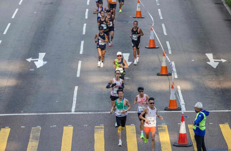 Hong Kong marathon runner with baby investigated for child abuse